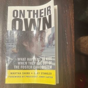 On Their Own paperback book - black, white & yellow cover